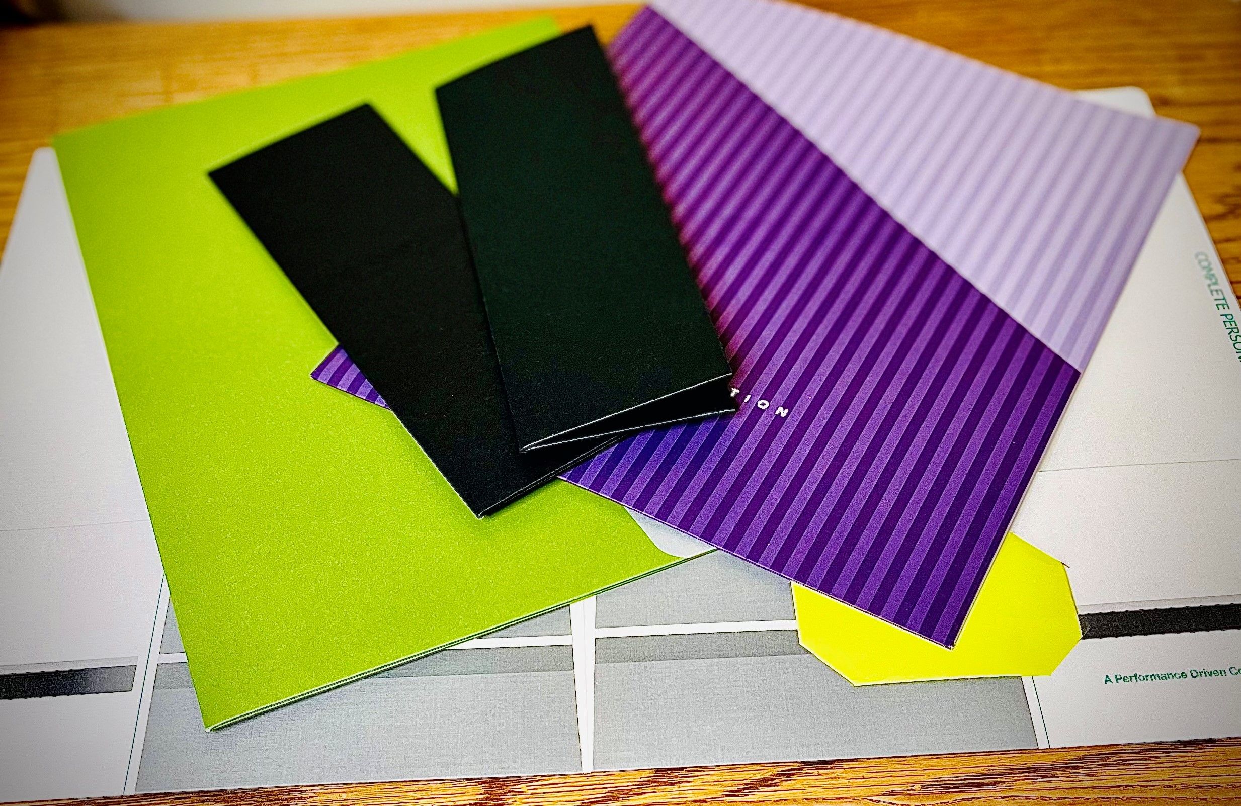 Printed, cut, glued or hand tapped, and folded. BCO can create folders of many shapes and sizes.